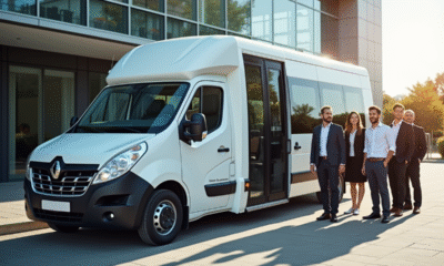 Minibus blanc moderne devant un bureau avec professionnels